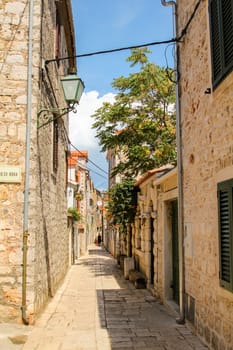 Tranquil narrow little alley in downtown Hvar, Croatia
