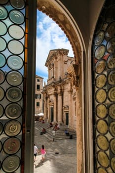 Portal of the baroque cathedral of Dubrovnik, seen through a window of the Rectors Palace, Croatia
