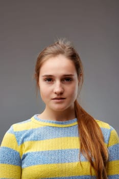 portrait of a serious and self-confident young woman, or slightly angry but determined and courageous