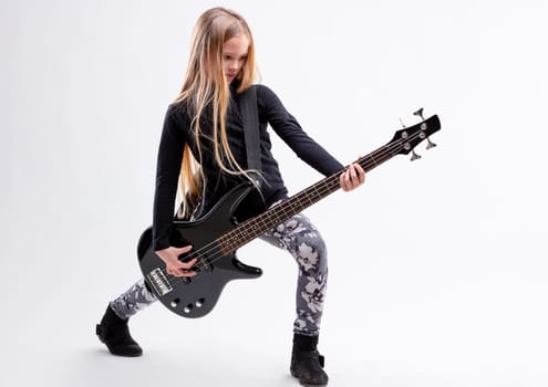 blonde long haired girl is a bass guitar metal or hard rock player