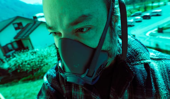 closeup of a man's face with a gas mask protecting from a pandemic COVID19 corona virus as he walks in the city street