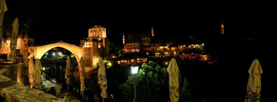 Famous rebuilt historic bridge in downtown Mostar at night, Bosnia and Herzegovina