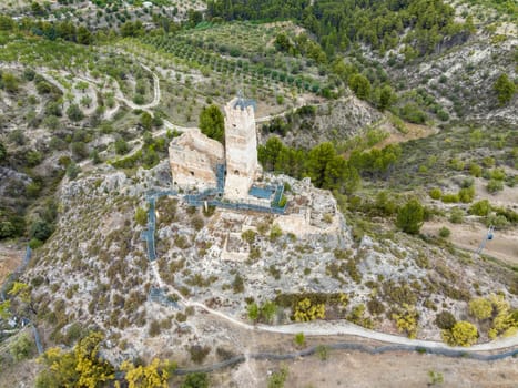Historic ruins of the old castle in Cocentaina near Alcoy in the Alicante mountain area. Aerial panoramic aerial view