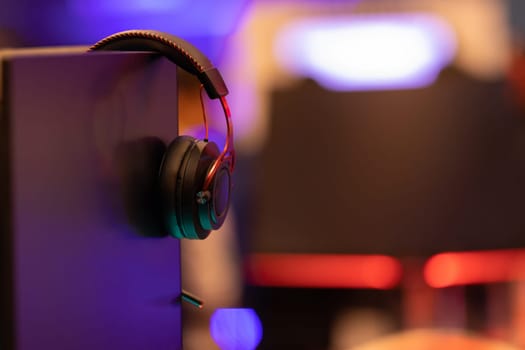 Gaming headphones on the side on the stand. Mid shot