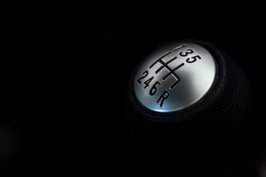 Close-up of a manual car gear shift knob, with ample space for text and designs.