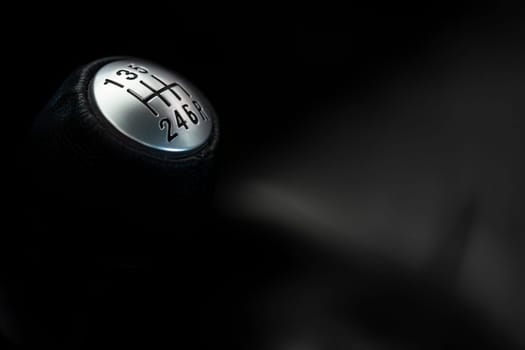 Close-up of a manual car gear shift knob, with ample space for text and designs.