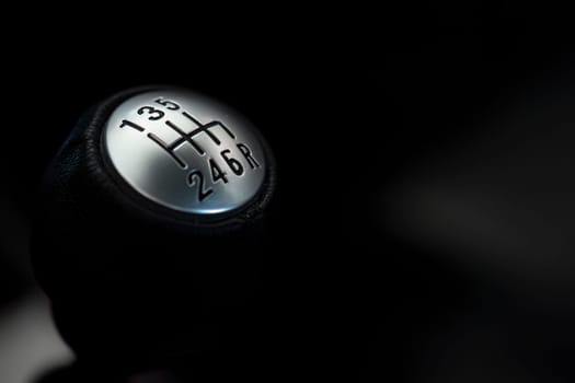 Close-up of a manual car gear shift knob, with ample space for text and designs.