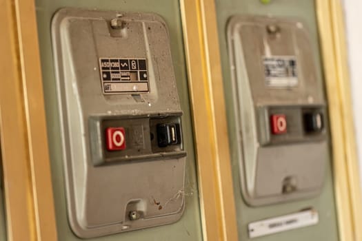 Milan, Italy 19 august 2023: Close-up of aged, obsolete high-voltage electrical switches with a nostalgic industrial feel.