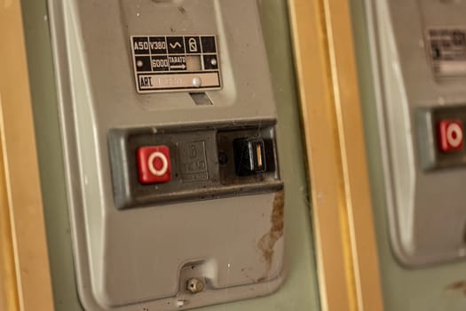 Milan, Italy 19 august 2023: Close-up of aged, obsolete high-voltage electrical switches with a nostalgic industrial feel.