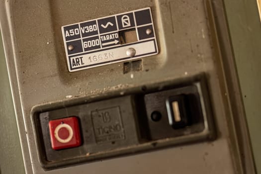 Milan, Italy 19 august 2023: Close-up of aged, obsolete high-voltage electrical switches with a nostalgic industrial feel.