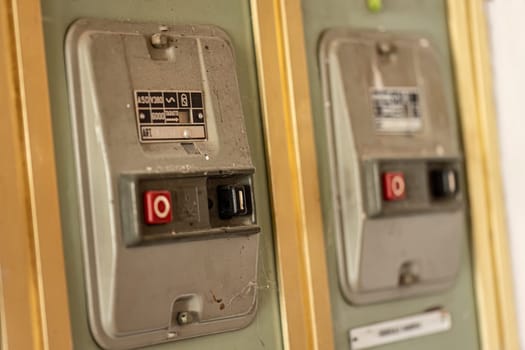 Milan, Italy 19 august 2023: Close-up of aged, obsolete high-voltage electrical switches with a nostalgic industrial feel.