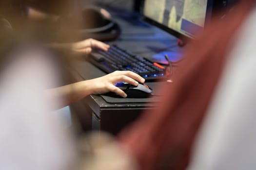 Playing PC games at game expo. Mid shot