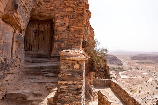 Hiking through the old Id Aissa agadir, an old granary in Amtoudi, Morocco