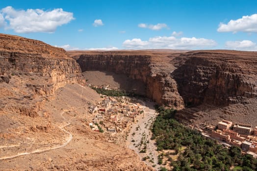 Hiking through the old Id Aissa agadir, an old granary in Amtoudi, Morocco