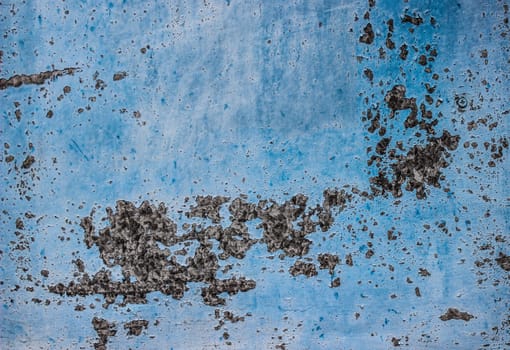 Closeup of a Metal or Steel Plate on the Back of a Truck that is Well Worn and Distressed with Blue Paint that Peeled with Copyspace