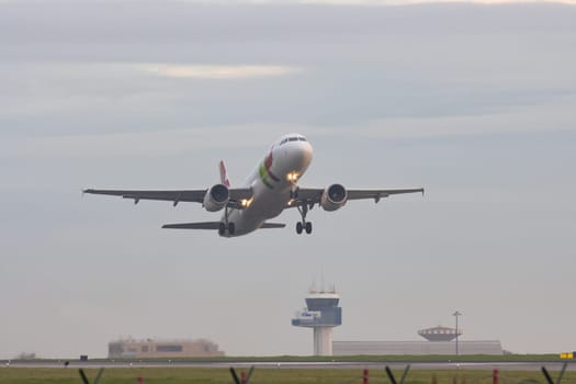 30 November 2022 PORTUGAL, LISBON: an AIRPORTUGAL airplane gains altitude from the runway. Mid shot