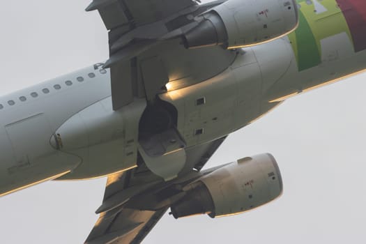 30 November 2022 PORTUGAL, LISBON: take-off aircraft retracts landing gear. Mid shot
