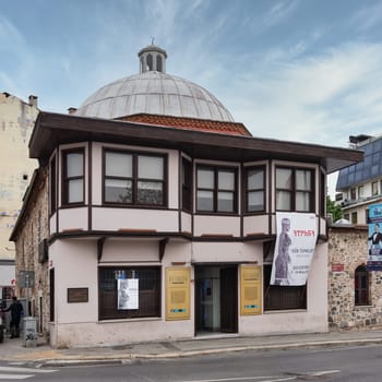 Istanbul, Turkey - May 12 2023: 17th century historic Husrev Kethuda Hamami, a Turkish bathhouse located in the Ortakoy district. The building is made of white stone and has a large dome in the center