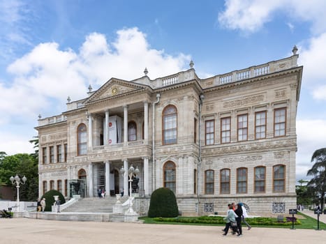 Istanbul, Turkey - May 10, 2023: Dolmabahce Palace, or Dolmabahce Sarayi, located in Besiktas district on the European coast of the Bosporus, main administrative center of the Ottoman Empire formerly