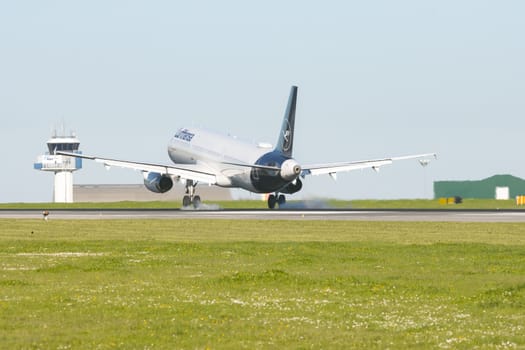 1 December 2022 PORTUGAL, LISBON: LUFTHANSA airplane landed on the runway. Mid shot
