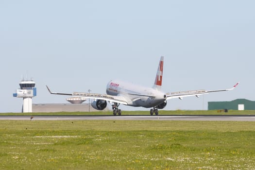 1 December 2022 PORTUGAL, LISBON: SWISS airlines passenger plane about to take off the runway. Mid shot