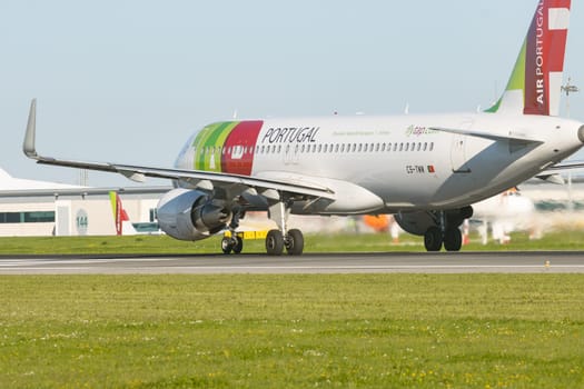 1 December 2022 PORTUGAL, LISBON: AIRPORTUGAL CS-TMW passenger plane on the runway. Mid shot