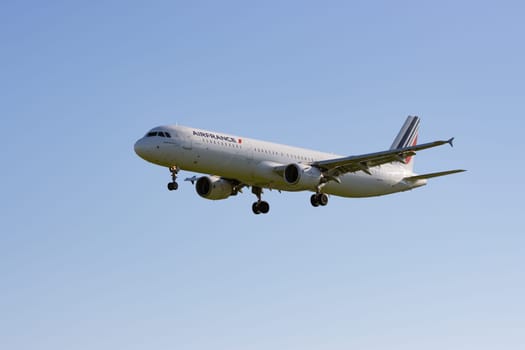 1 December 2022 PORTUGAL, LISBON: AIRFRANCE passenger plane flies in the sky. Mid shot
