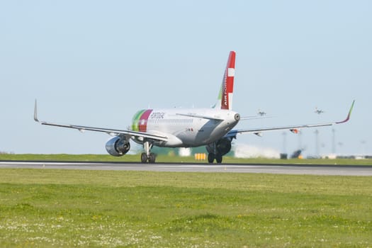 1 December 2022 PORTUGAL, LISBON: AIRPORTUGAL CS-TMW riding plane on the runway. Mid shot