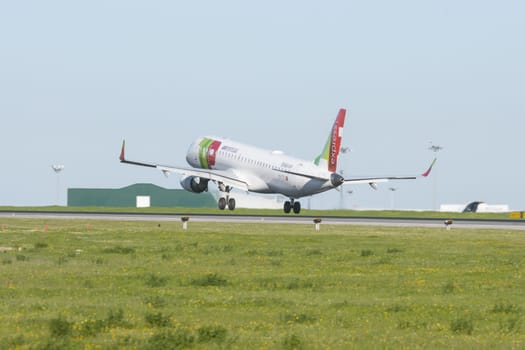 1 December 2022 PORTUGAL, LISBON: AIRPORTUGAL CS-TTY express airplane took off the runway. Mid shot