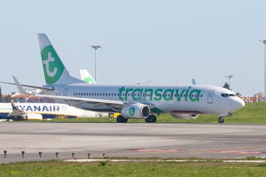 1 December 2022 PORTUGAL, LISBON: TRANSAVIA passenger plane is preparing to leave for the runway. Mid shot
