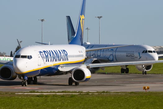 1 December 2022 PORTUGAL, LISBON: RYANAIR passenger plane on the field. Mid shot