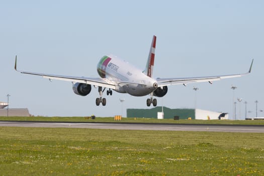 1 December 2022 PORTUGAL, LISBON: AIRPORTUGAL passenger plane takes off the runway. Mid shot