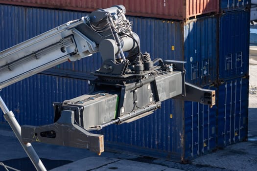 Big cargo spreader for container lifting at the port. Mid shot