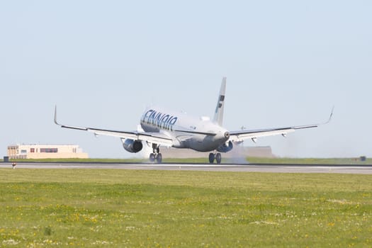 1 December 2022 PORTUGAL, LISBON: FINNAIR passenger plane takes off the runway. Mid shot