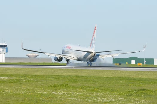 1 December 2022 PORTUGAL, LISBON: AIREUROPE airplane landed on the runway. Mid shot