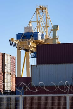 Viewpoint above the cargo seaport with lots of containers. Mid shot