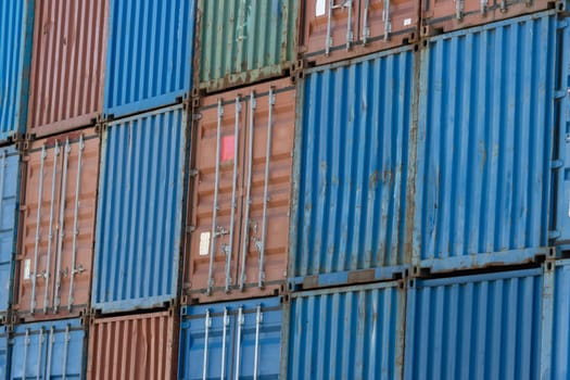 Closed doors of multicolored cargo containers. Mid shot