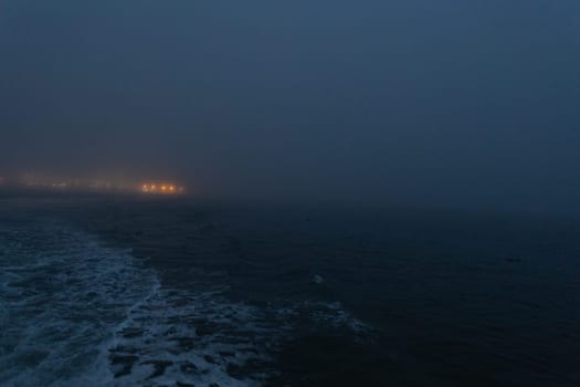 Foggy calm sea in the late evening. Mid shot