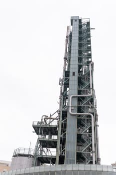 Tall tower for oil and gas refining. Vertical shot
