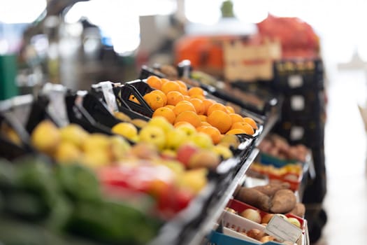 Fresh fruits and vegetables at the market. Mid shot