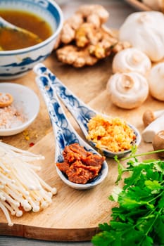 Miso paste and ginger garlic paste for miso or ramen soup on wooden background