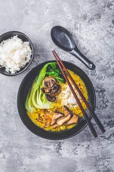 Egg flower soup, tomato egg drop soup with mushrooms, bok choy and rice. Asian cuisine