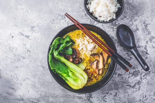 Egg flower soup, tomato egg drop soup with mushrooms, bok choy and rice. Asian cuisine