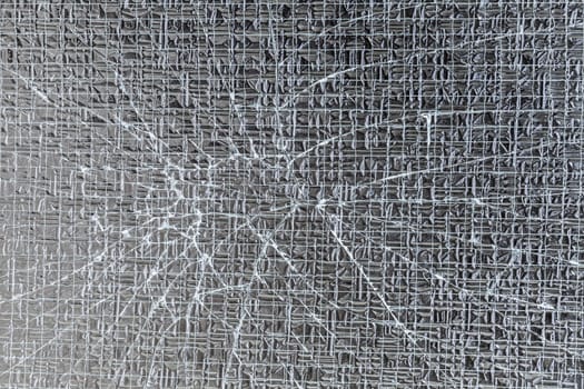 Broken laminated safety glass background and texture
