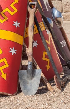 Entrenching tools supported in shields. Digging tools used by ancient roman army