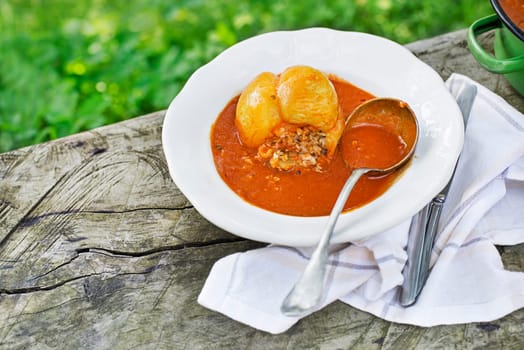 Stuffed peppers with ground meat and rice in tomato sauce with mashed potatoes. European traditional dish cuisine