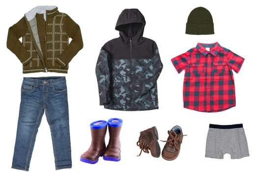 Collage set of little boys autumn clothes isolated on a white background. Denim trousers and jacket, sneaker, a down jacket, pants and shirts for child boy. Children's winter fashion.