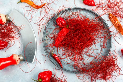 Spicy seasoning, spice, cut from red pepper. Thinly sliced pepper.
