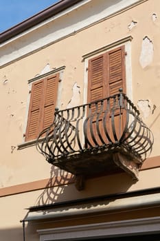 Balcony of a historic house in the old town of Malcesine on the shore of Lake Garda in Italy