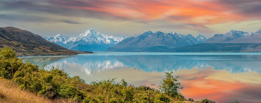 Scenic reflection of Mount Sefton and Mount Cook at lake Pukaki, South Island of New Zealand